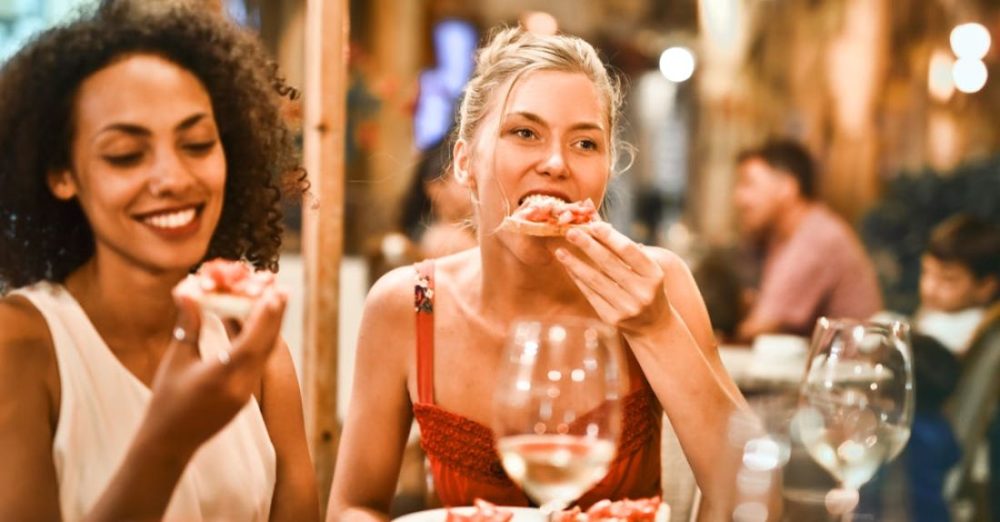 Dining - Woman Eating Bruschetta