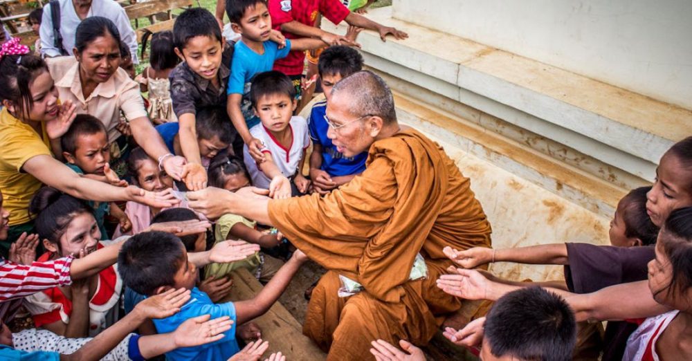 Charity - Monk Surrounded by Children