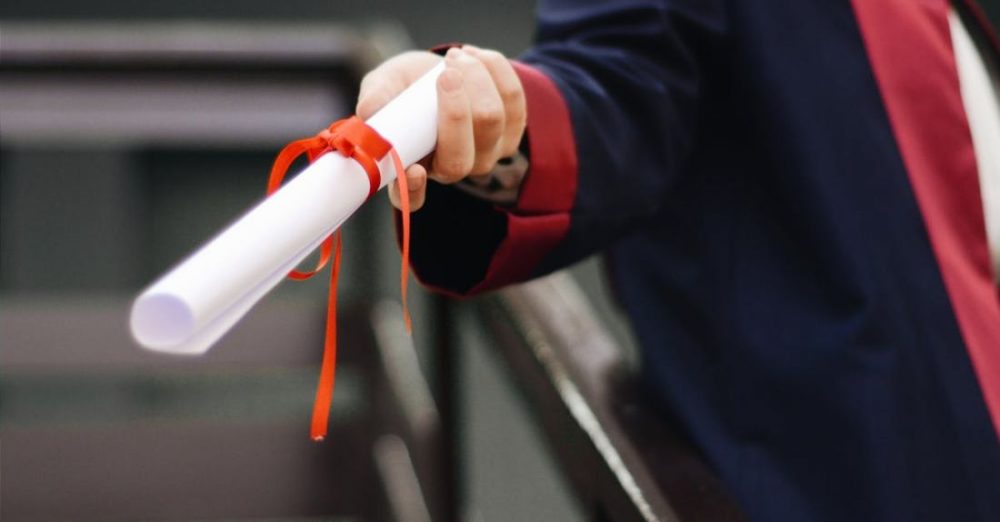 Graduation - Person Holding White Scroll