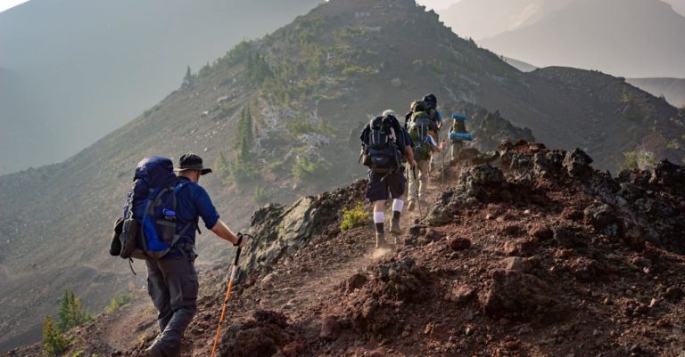 Hike - Group of Person Walking in Mountain