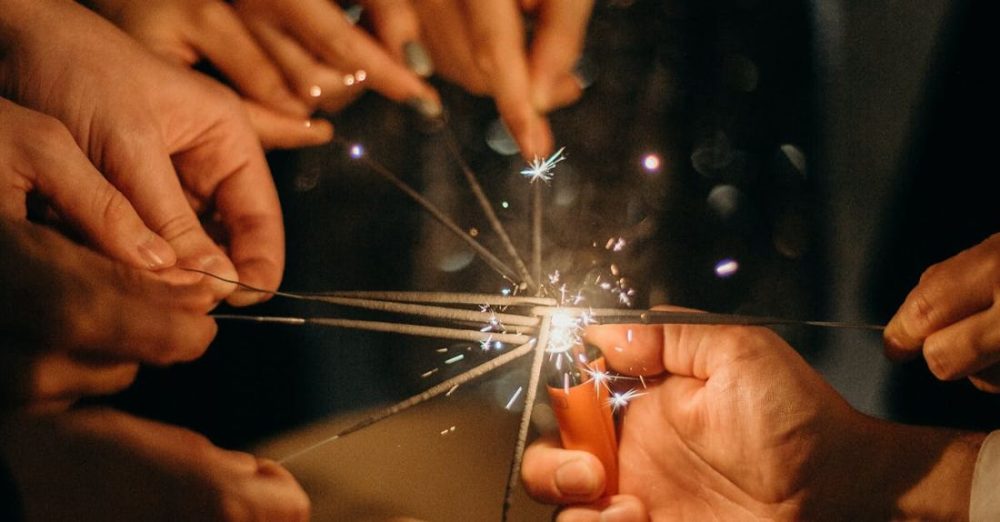 Holidays - People Lighting Sparklers