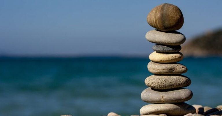 Relaxation - Cairn Stones and Body of Water in Distance