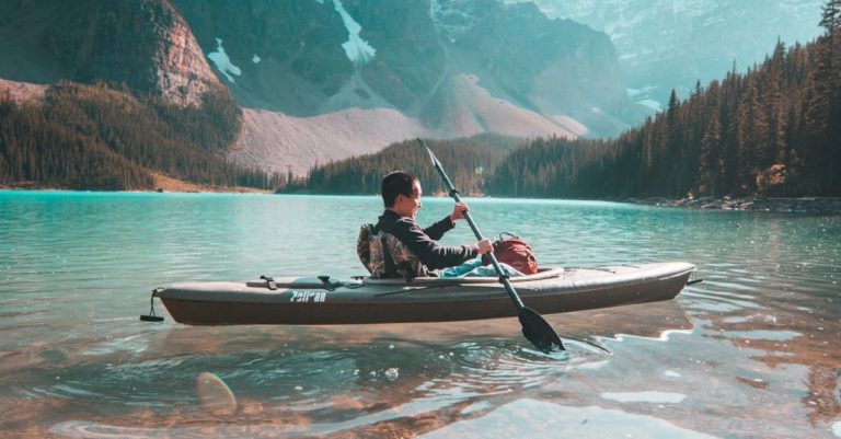 Canoeing - Person Riding on Gray Kayak